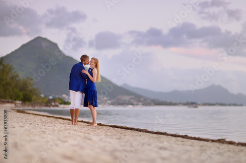 Beautiful romantic couple on a tropical beach © MNStudio