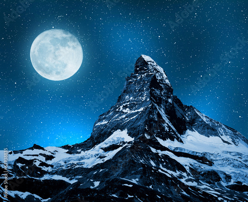Matterhorn in night sky with moon - Swiss Alps