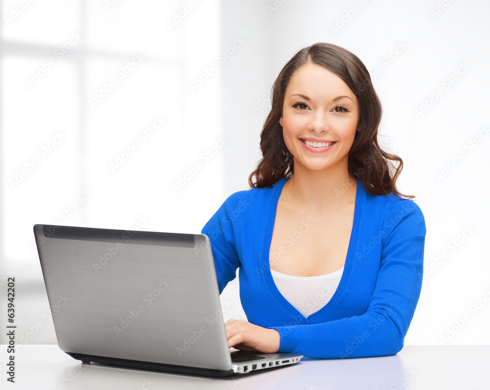 smiling woman in blue clothes with laptop computer smiling woman in blue clothes with laptop computer