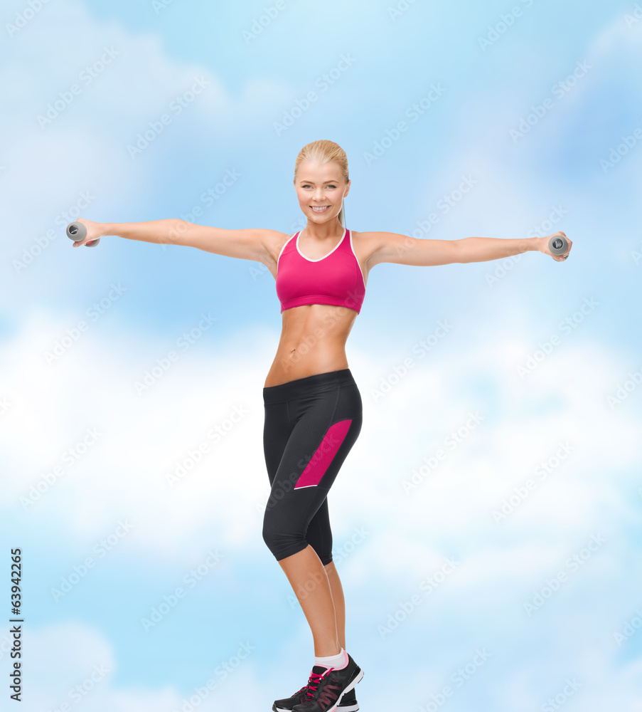 young sporty woman with light dumbbells young sporty woman with light dumbbells