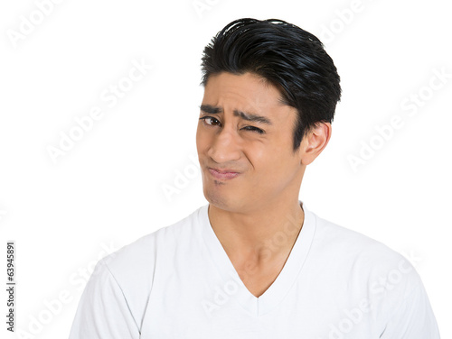 Portrait Skeptical man full off doubt, isolated white background photo