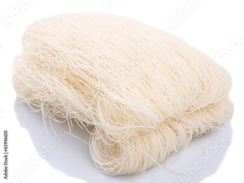 Rice vermicelli over white background photo