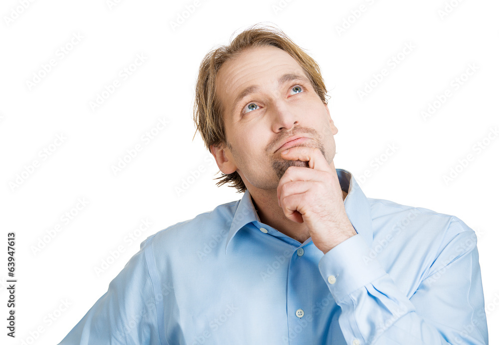 Daydreaming man, looking up, isolated on white background 