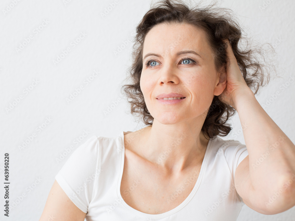 Brown-haired woman thinking about something Brown-haired woman thinking about something