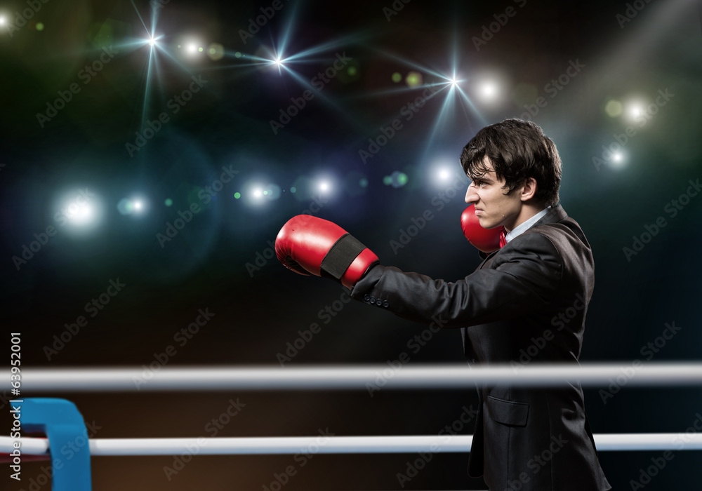 businessman with boxing gloves in the ring