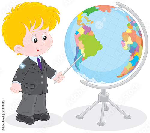 Schoolboy points to a country on a big globe