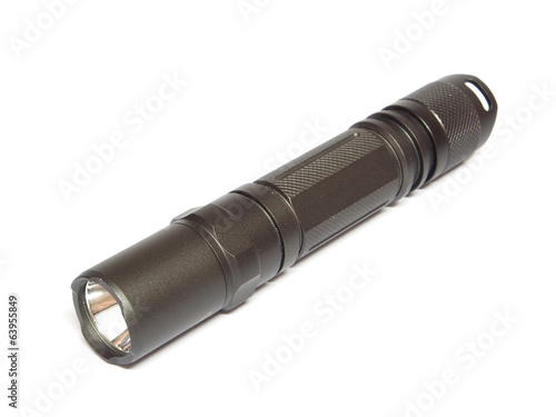 Military electric LED flashlight isolated on a white background