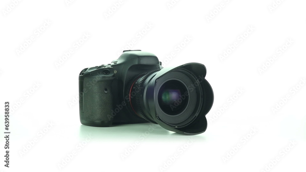 DSLR camera rotates on a white background DSLR camera rotates on a white background