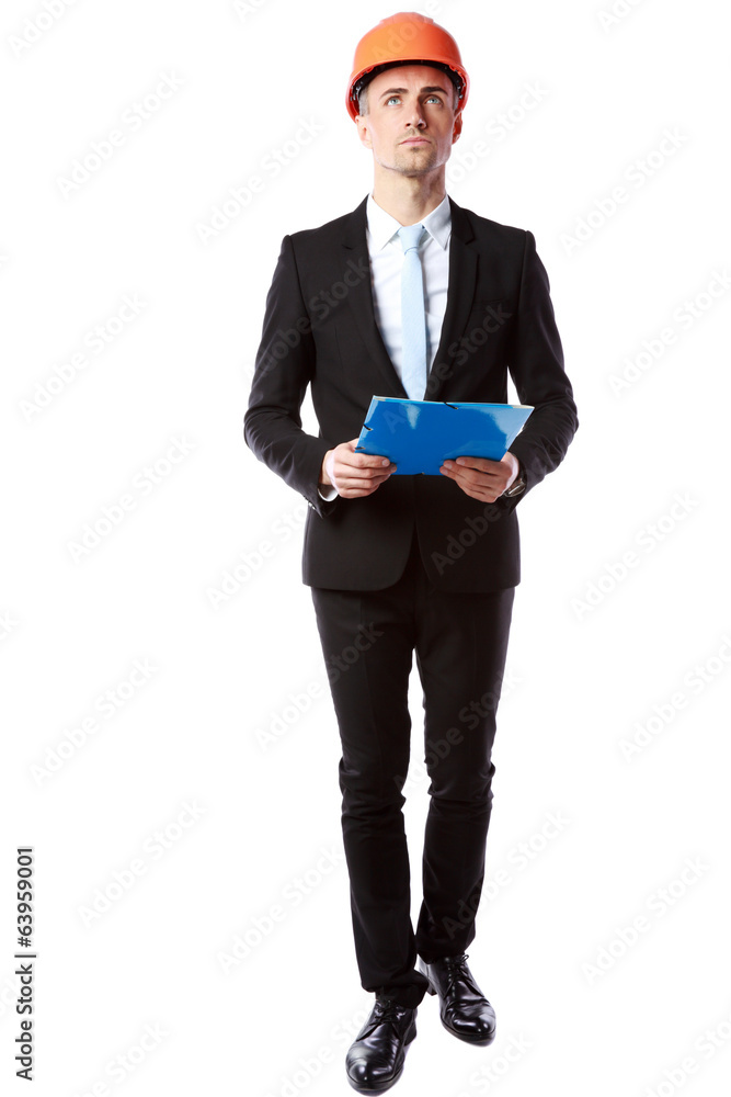 confident businessman in helmet holding blue folder confident businessman in helmet holding blue folder