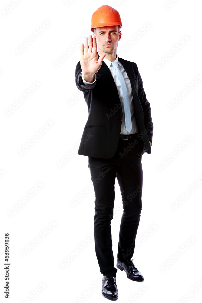 businessman in helmet showing stop gesture businessman in helmet showing stop gesture
