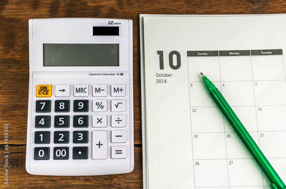 October organizer with calculator & pen: concept for monthly bud October organizer with calculator & pen: concept for monthly bud