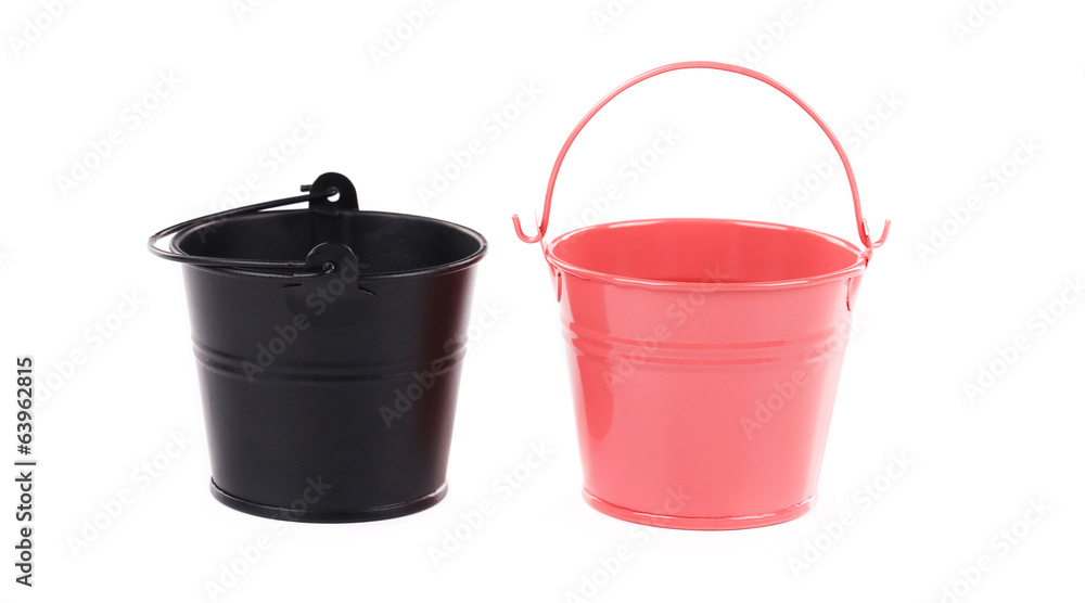 Black and pink metal buckets.