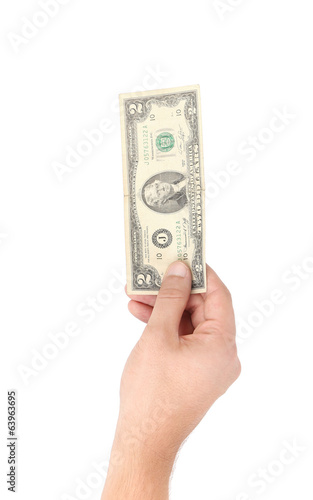Hand holding two dollar bill.
