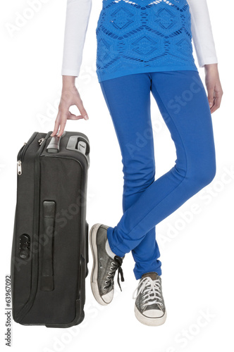 Young woman waist down and her suitcase