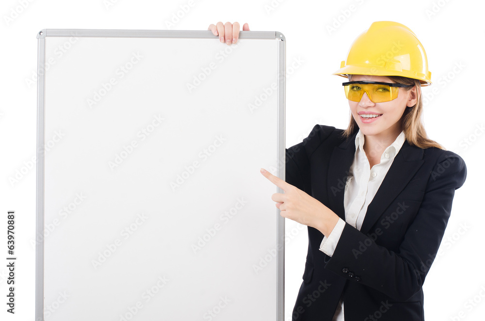 Young builder woman with blank board isolated on white Young builder woman with blank board isolated on white