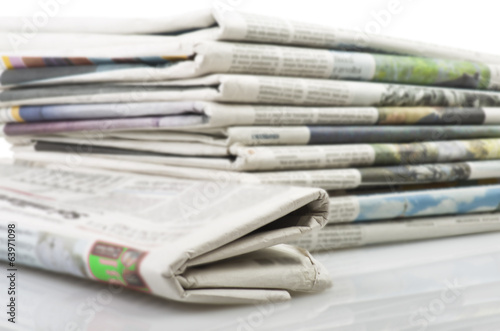 Wallpaper Mural Pile of Various newspapers over white background Torontodigital.ca