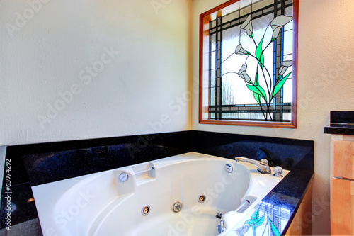 Bathroom with stained glass window