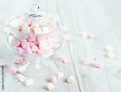 marshmallows in beautiful glass dish on a wooden table