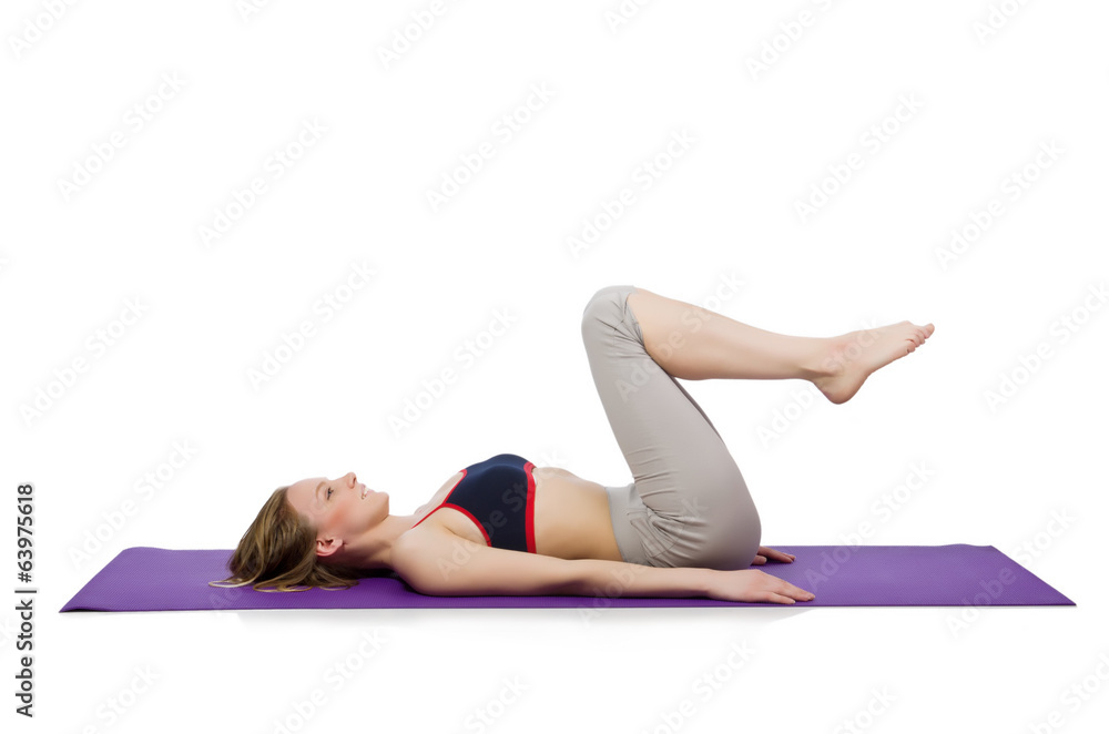 Young female doing exercises on white Young female doing exercises on white