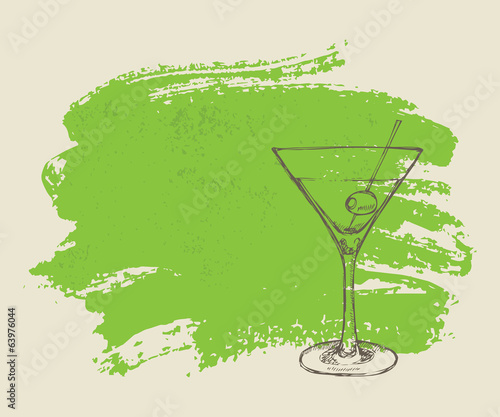 Iced cocktail on green grunge background