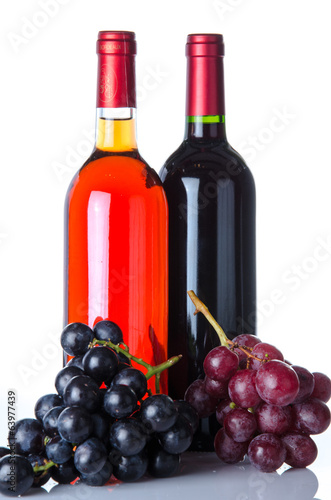Bottles of wine and a grapes