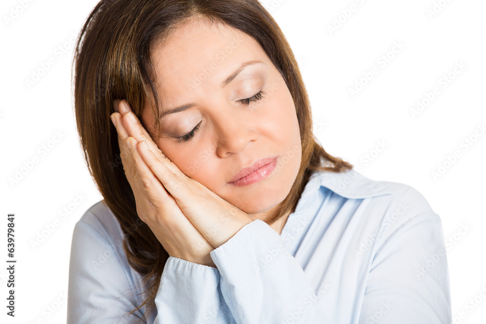 Headshot middle aged woman taking nap on white background Headshot middle aged woman taking nap on white background