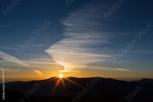 Red sunrise with blue sky and clouds