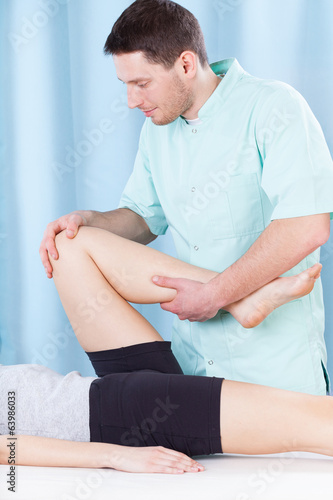 Physiotherapist doing leg massage