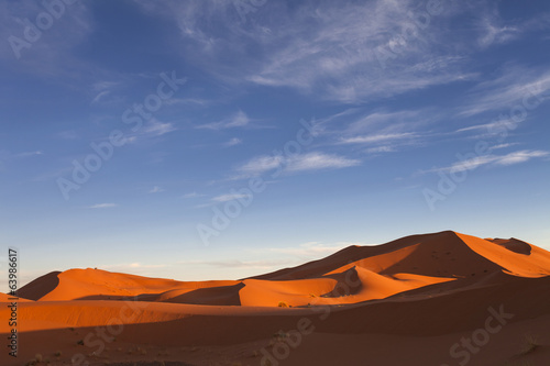 Fototapeta Naklejka Na Ścianę i Meble -  Moroccan desert landscape with blue sky. Dunes background.