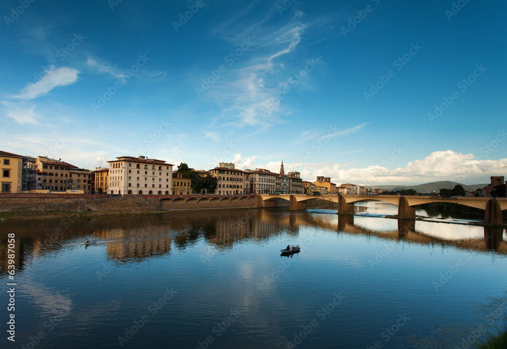 Florence across the Arno River. In the river by canoe canoeing.