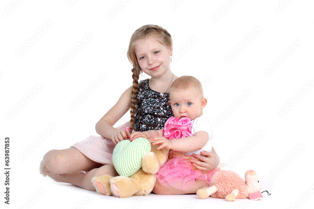 adorable little two sisters 8 year and 11 month old on white ba adorable little two sisters 8 year and 11 month old on white ba