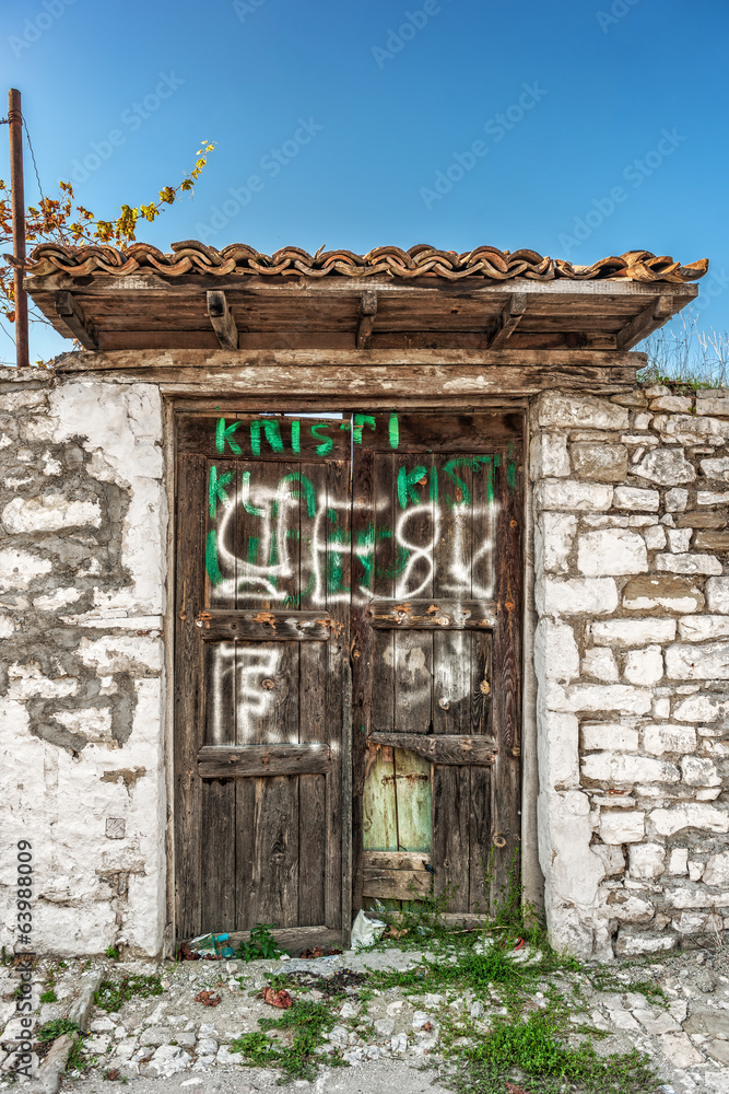 Fototapeta premium Weathered house wooden door in Berat, Albania.NEF