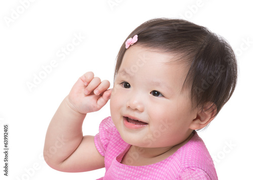 Asian baby girl hand touch her ear