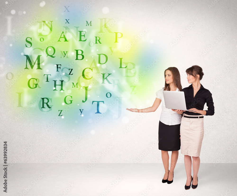 Business women with glowing letter concept Business women with glowing letter concept