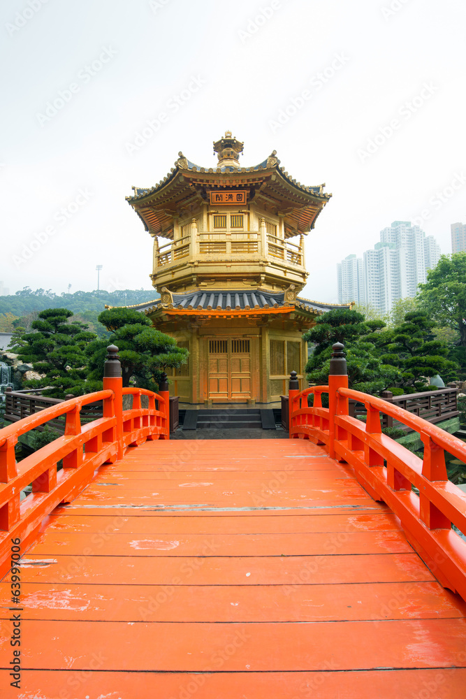 Naklejka premium The Golden pavilion and red bridge in Nan Lian Garden, Hong Kong
