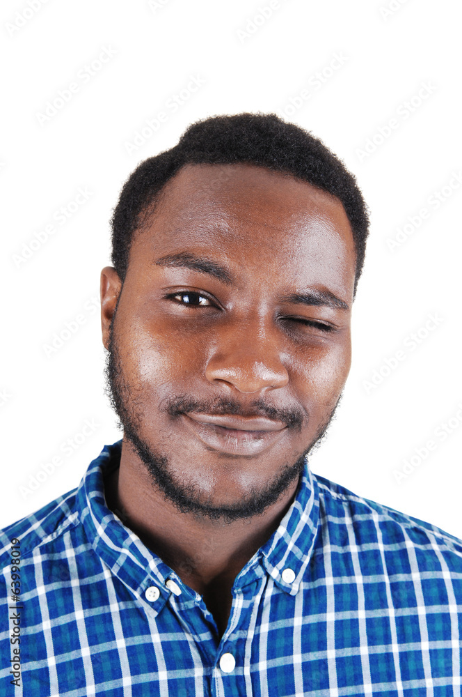 Obraz premium Black man blinking with his eye.