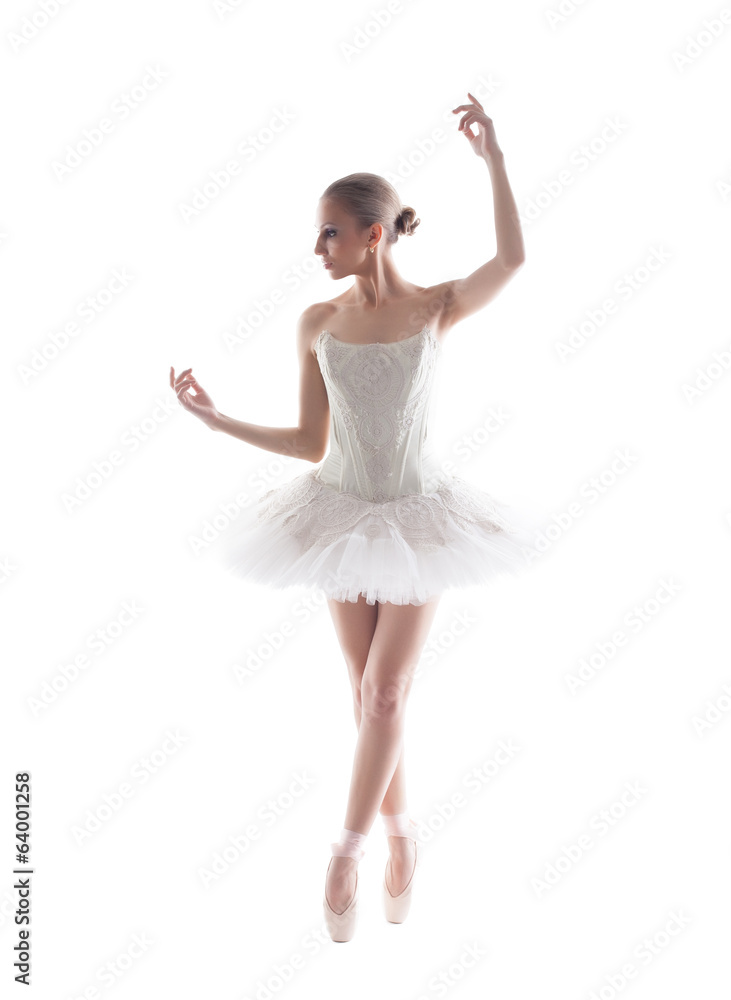 Elegant young ballerina isolated on white backdrop Elegant young ballerina isolated on white backdrop