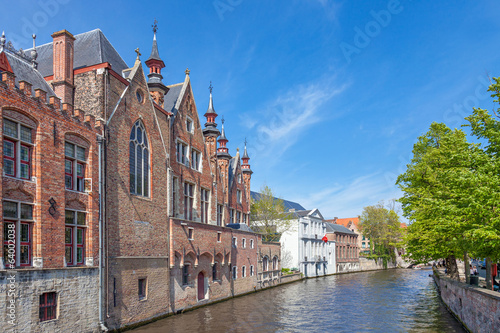 Canal in Bruges with an ancient red brick building