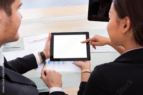 Business Colleagues Using Digital Tablet photo