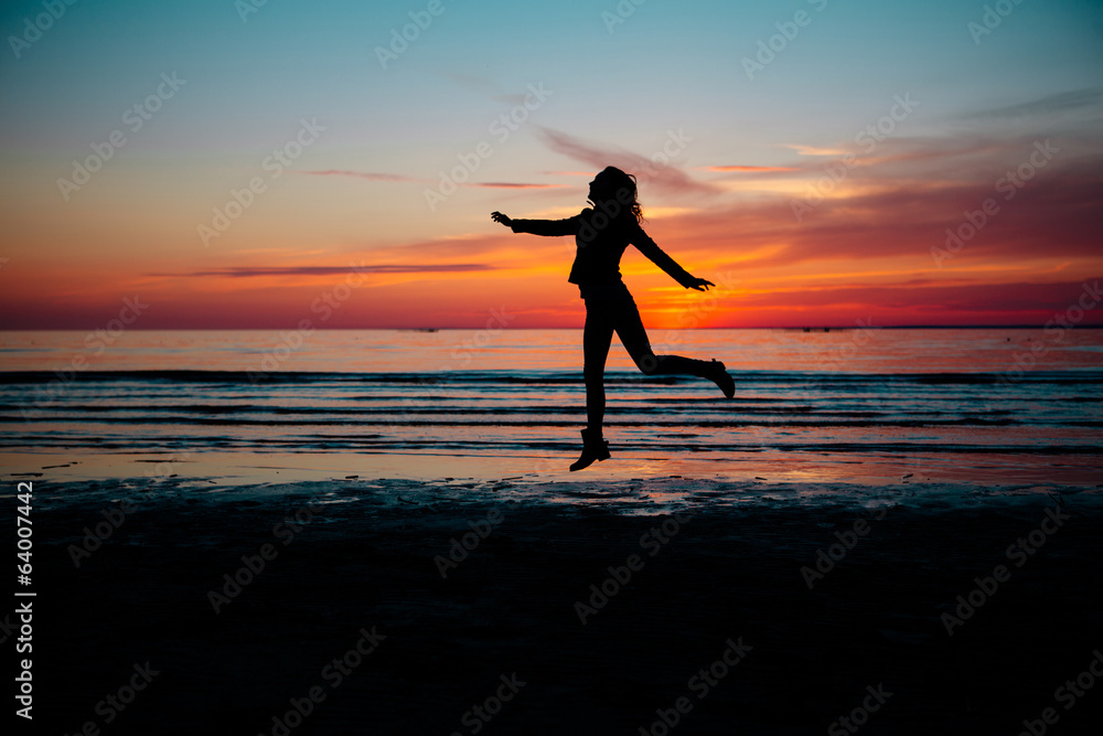 silhouette of woman on the sunset