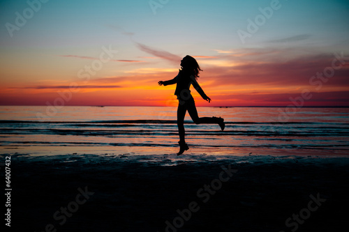 Silhouette of Woman on the Sunset