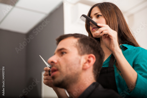 Lady barber cutting hair