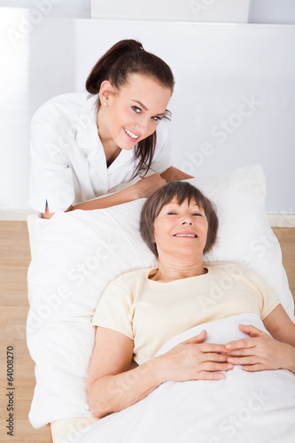 Female Doctor Consoling Senior Woman