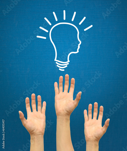 Hands raise brain idea on blue background 