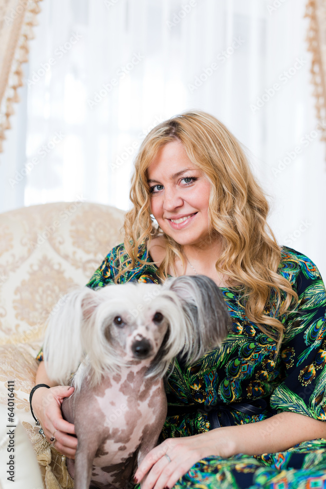 Woman keeping Chinese crested dog Woman keeping Chinese crested dog