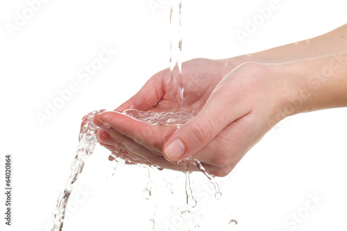 Human hands with water splashing on them isolated on white