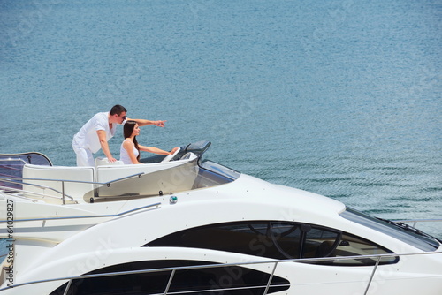 young couple on yacht