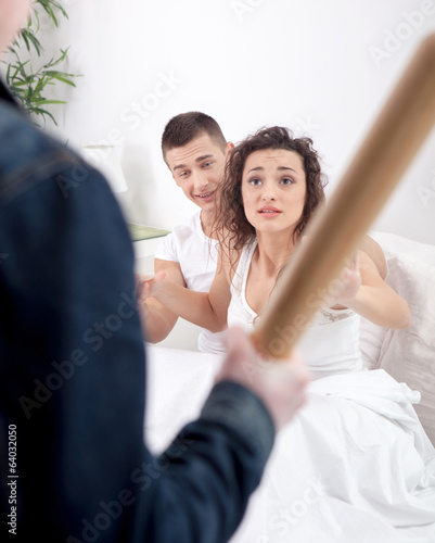 Canvas Print angry husband with baseball bat caught cheating wife with lover
