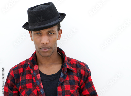 Confident young man with hat