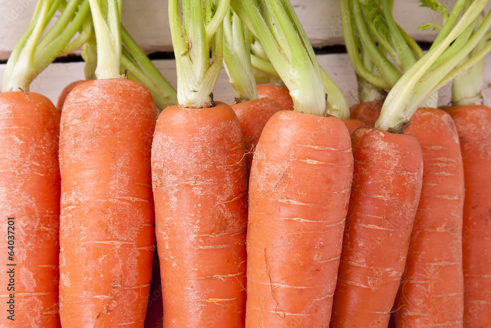 stacked fresh carrots on white background, vegetables stacked fresh carrots on white background, vegetables